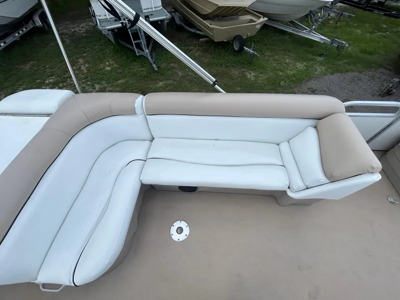 Slide: The Image of 2014 Bennington S22 Saltwater Series boat with beige and white seating. - 10