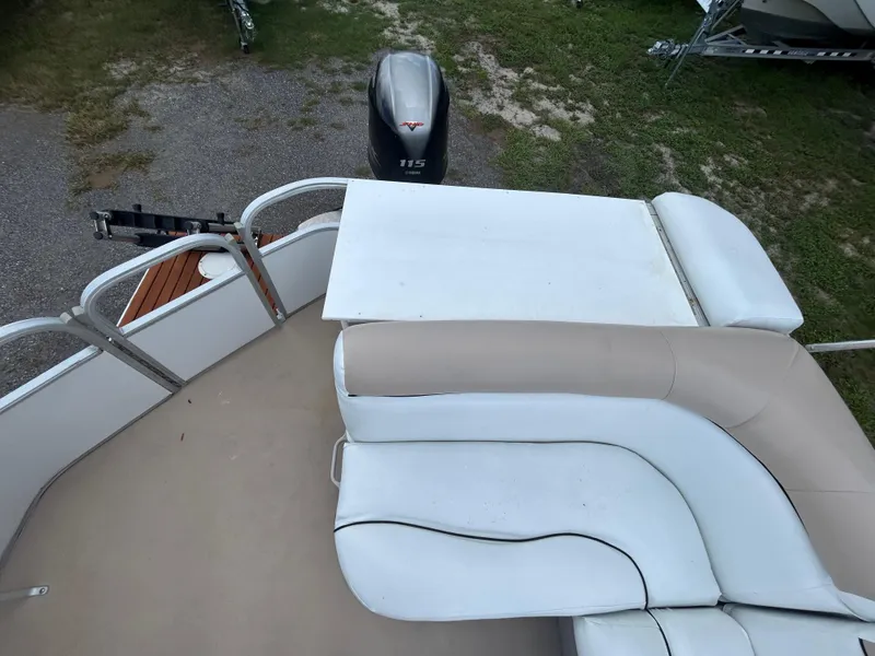 Slide: The Image of 2014 Bennington S22 Saltwater Series boat with seating and outboard motor. - 11