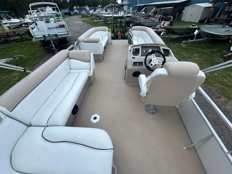 Slide: The Image of 2014 Bennington S22 Saltwater Series pontoon boat with spacious seating and steering console. - 13