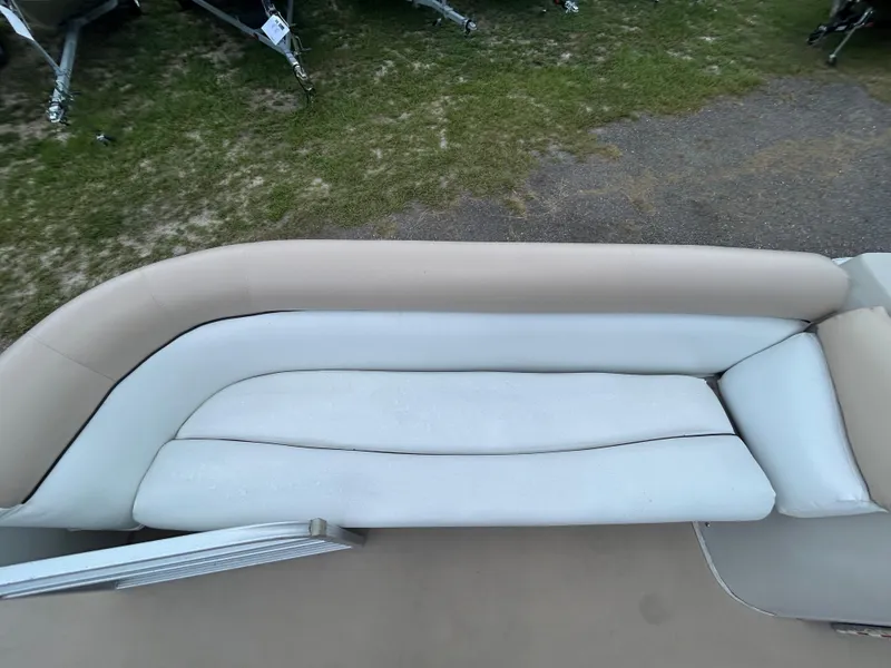 Slide: The Image of 2014 Bennington S22 Saltwater Series boat seating, beige and white upholstery. - 9