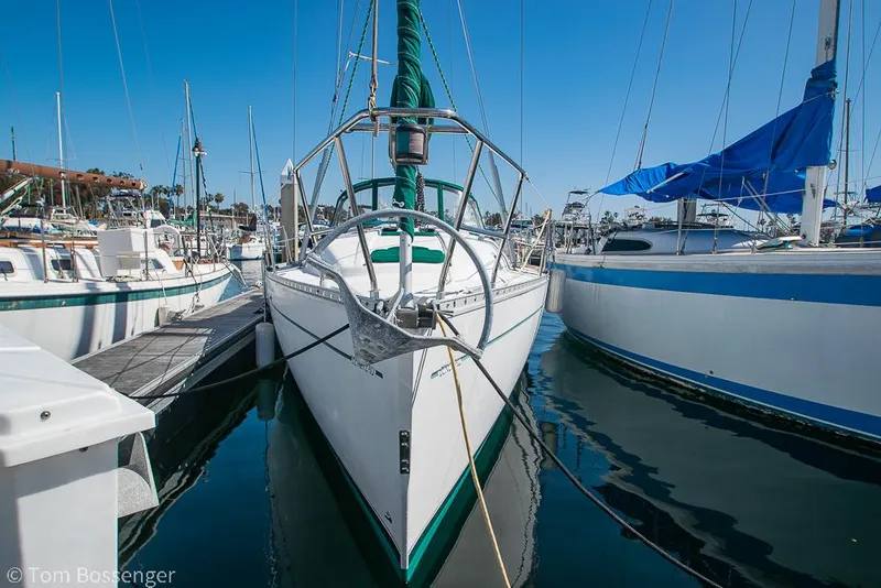 Slide: The Image of Beneteau Oceanis 35.1 sailboat docked in marina, 1995 model, sunny day. - 2