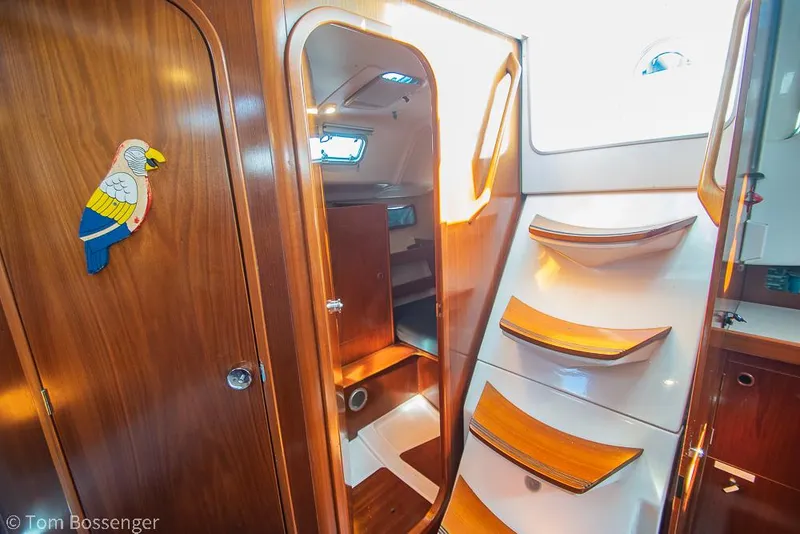 Slide: The Image of Interior of 1995 Beneteau Oceanis 35.1 sailboat with wooden stairs and cabinetry. - 22