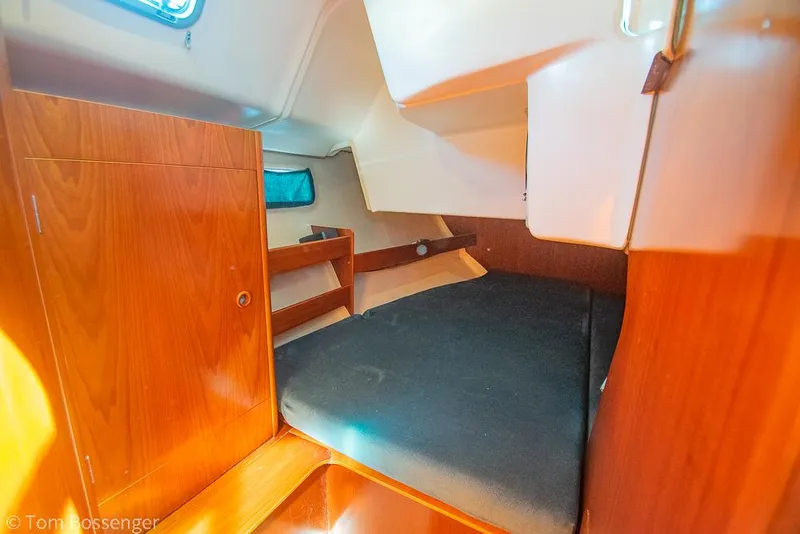 Slide: The Image of Cozy cabin interior of a 1995 Beneteau Oceanis 35.1 sailboat with wooden finishes. - 23
