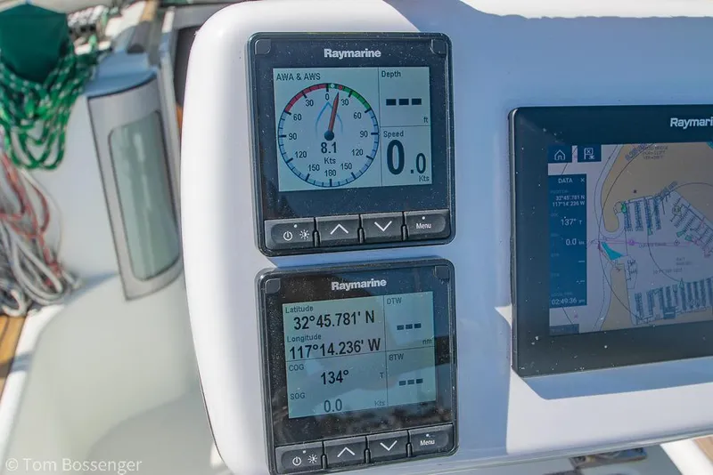Slide: The Image of Raymarine navigation instruments on a 1995 Beneteau Oceanis 35.1 sailboat dashboard. - 30