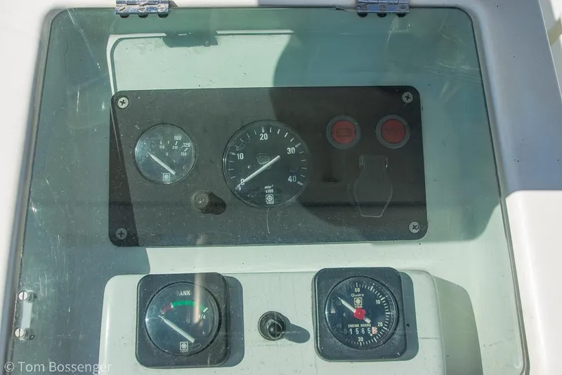 Slide: The Image of Control panel of a 1995 Beneteau Oceanis 35.1 sailboat, featuring gauges and switches. - 33