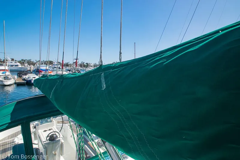 Slide: The Image of Beneteau Oceanis 35.1 sailboat, 1995 model, docked with green sail cover. - 39