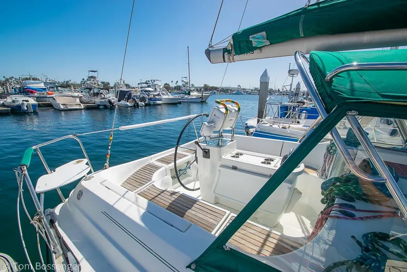 Slide: The Image of Beneteau Oceanis 35.1 sailboat, 1995 model, docked in a sunny marina. - 4