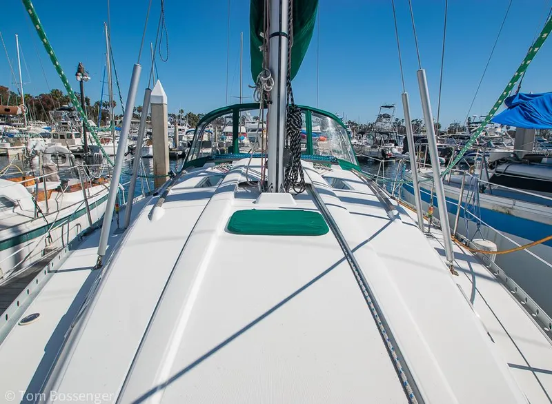 Slide: The Image of Beneteau Oceanis 35.1 sailboat deck view, docked in a marina, clear blue sky. - 41