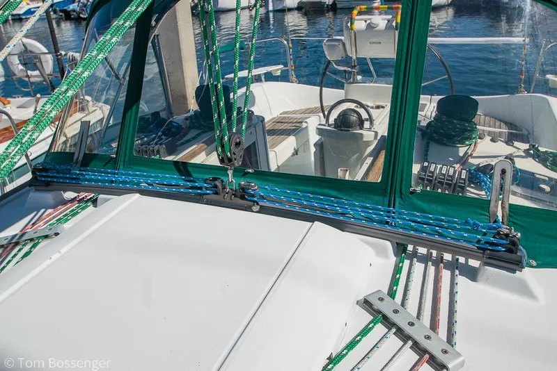 Slide: The Image of Beneteau Oceanis 35.1 sailboat cockpit with green rigging, 1995 model, docked at marina. - 43