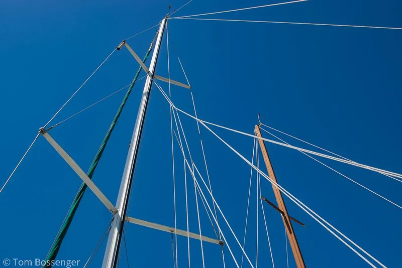 Slide: The Image of Masts and rigging of a 1995 Beneteau Oceanis 35.1 sailboat against a clear blue sky. - 44