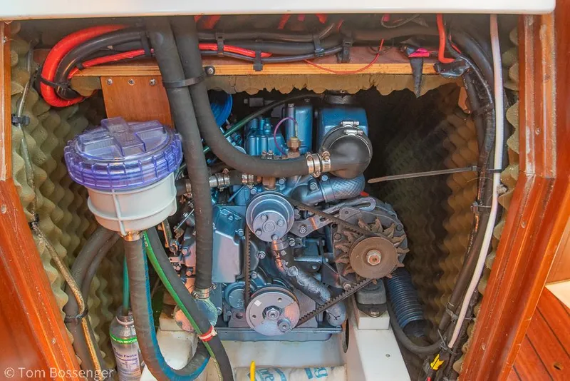 Slide: The Image of Engine compartment of a 1995 Beneteau Oceanis 35.1 sailboat, showcasing mechanical components. - 46