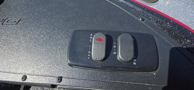 Slide: The Image of Control panel of a 2025 Nitro Z17 boat with trim and anchor light switches. - 21