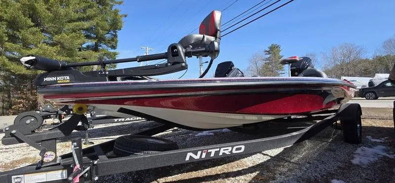 Slide: The Image of 2025 Nitro Z17 boat on trailer, red and black design, outdoor setting. - 4
