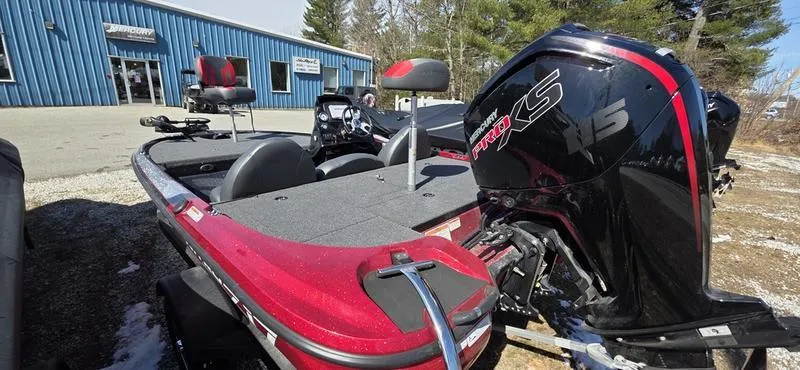 Slide: The Image of 2025 Nitro Z17 boat with powerful engine, parked outdoors near a blue building. - 8