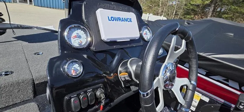 Slide: The Image of 2025 Nitro Z17 boat dashboard with Lowrance display and steering wheel. - 9