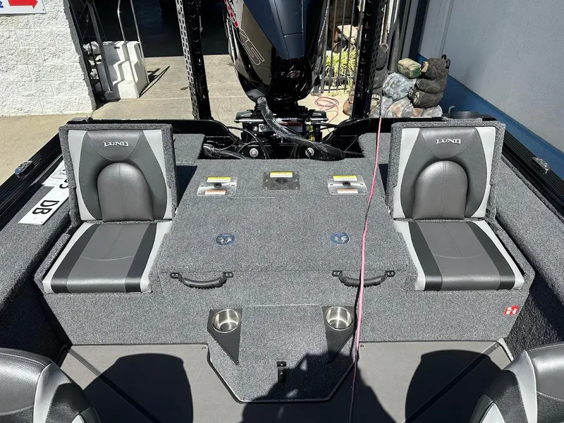 Slide: The Image of 2025 Lund 2075 Pro-V Bass XS boat interior with seating and storage compartments. - 10