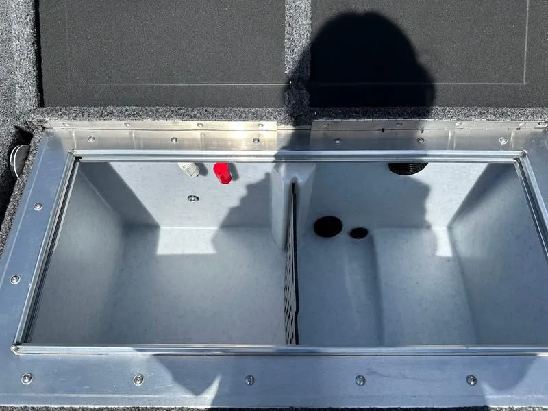 Slide: The Image of 2025 Lund 2075 Pro-V Bass XS livewell compartment, open lid, interior view. - 13
