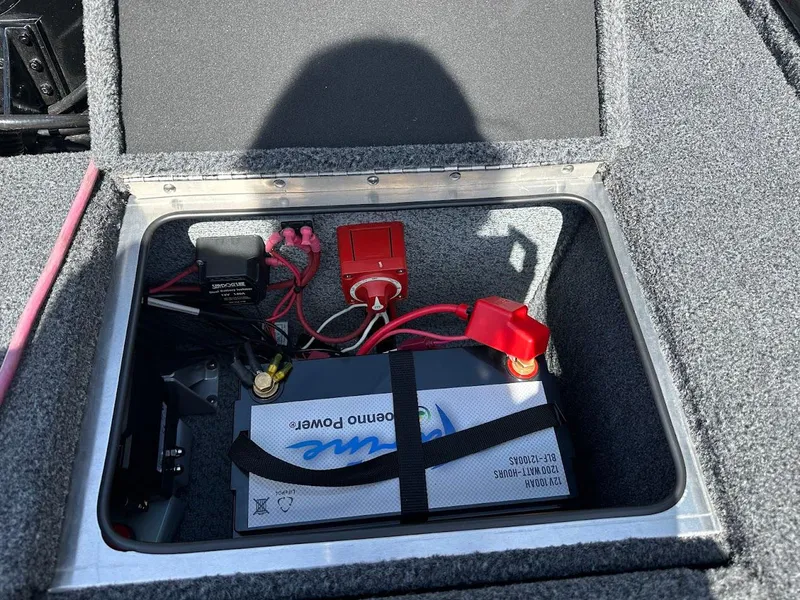 Slide: The Image of Battery compartment of 2025 Lund 2075 Pro-V Bass XS boat, featuring wiring and components. - 15