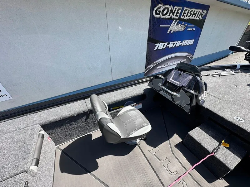 Slide: The Image of 2025 Lund 2075 Pro-V Bass XS boat interior with seating and control panel. - 17