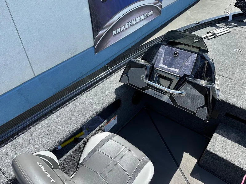 Slide: The Image of 2025 Lund 2075 Pro-V Bass XS boat interior with modern dashboard and seating. - 18