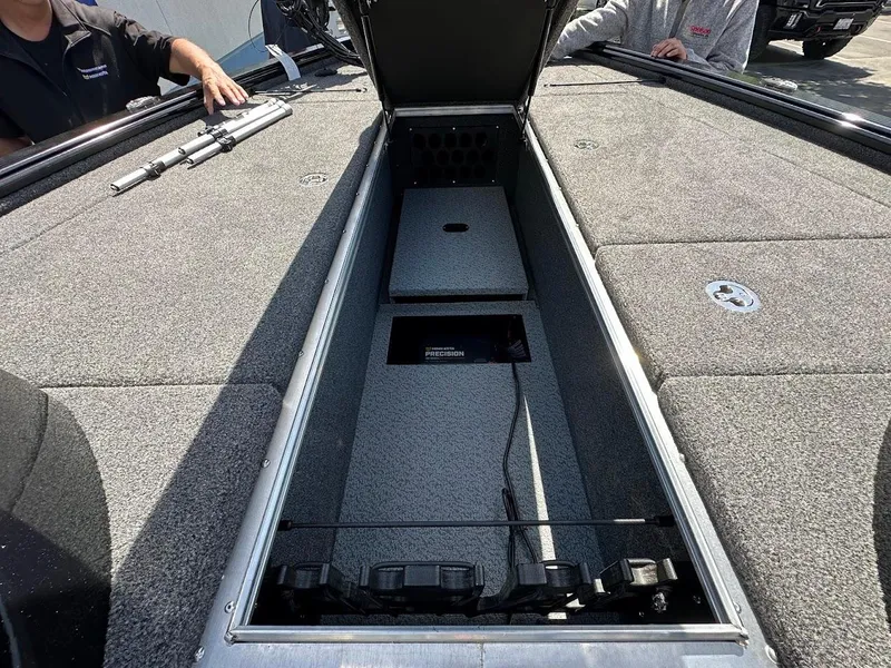 Slide: The Image of 2025 Lund 2075 Pro-V Bass XS boat with open storage compartment on deck. - 32