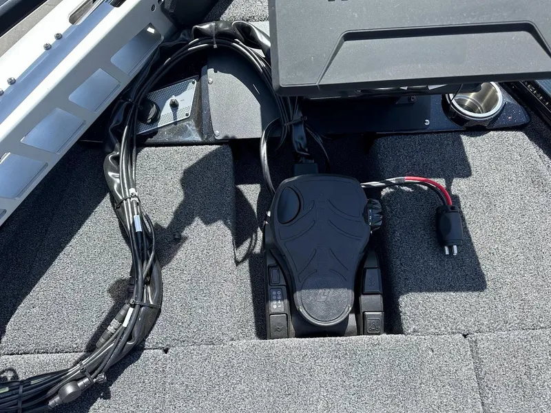 Slide: The Image of 2025 Lund 2075 Pro-V Bass XS boat interior with foot pedal and wiring. - 41