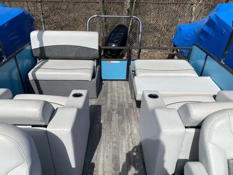 Slide: The Image of 2019 Crest Classic Platinum 220 SLRC pontoon boat interior with gray seating and cup holders. - 10