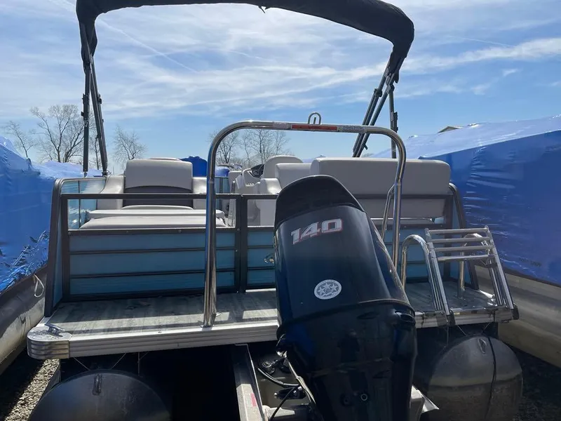 Slide: The Image of 2019 Crest Classic Platinum 220 SLRC pontoon boat with 140 HP engine, rear view. - 12
