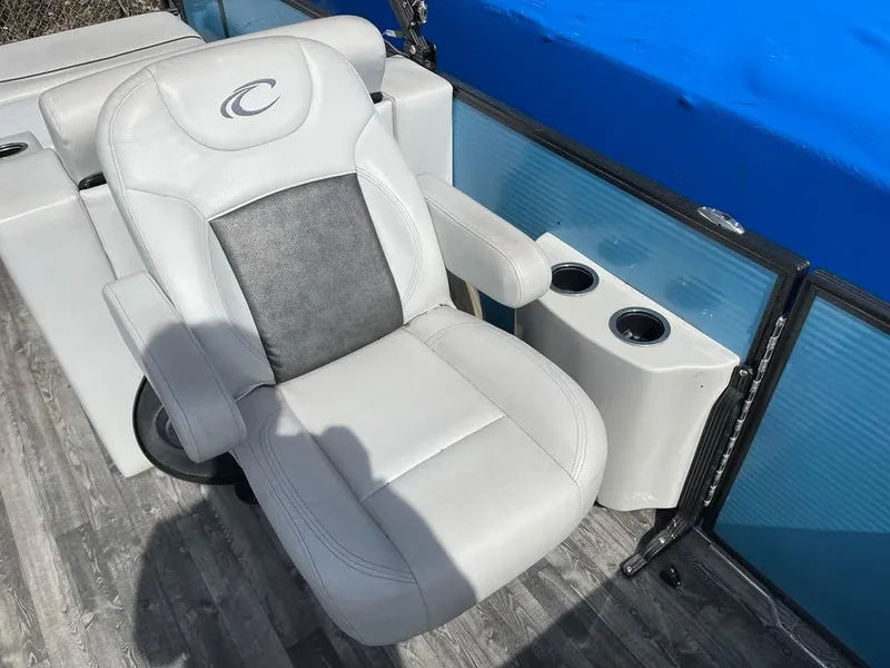 Slide: The Image of Luxurious seating on 2019 Crest Classic Platinum 220 SLRC pontoon boat with cup holders. - 7