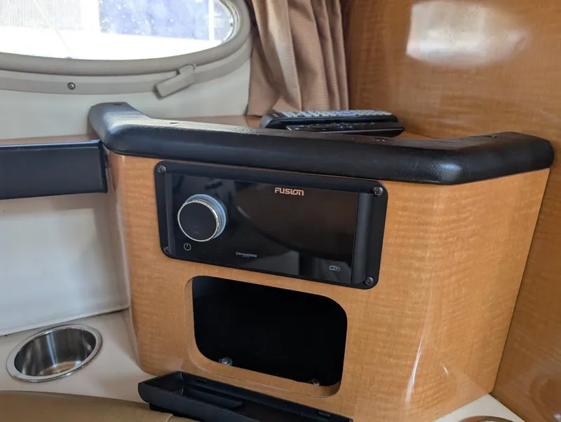 Slide: The Image of 2006 Chaparral 310 Signature interior with Fusion stereo system and wood finish. - 27