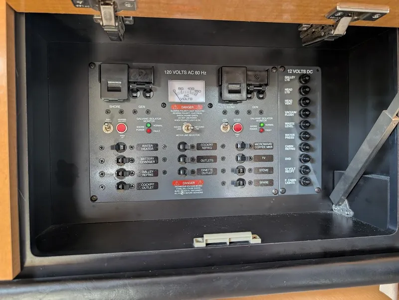 Slide: The Image of Electrical panel of a 2006 Chaparral 310 Signature boat, featuring various switches and indicators. - 31