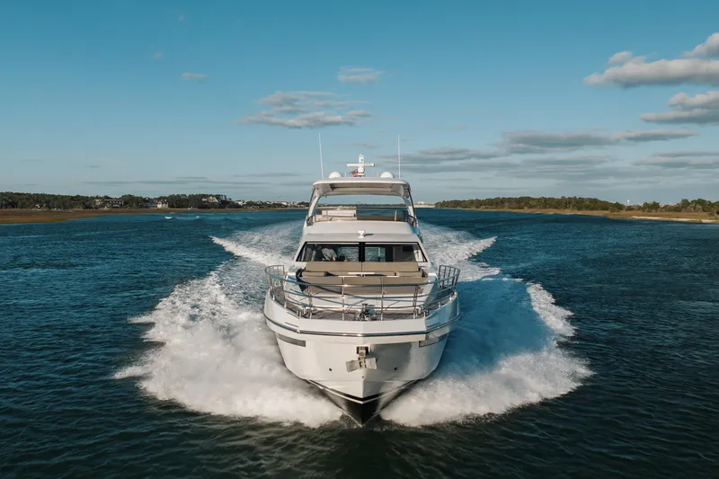 Slide: The Image of 2021 Azimut 72 yacht cruising on open water under a clear blue sky. - 15