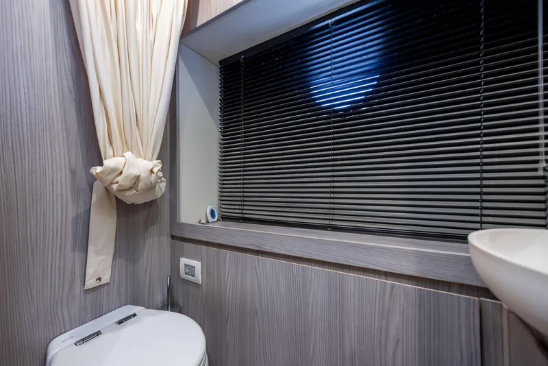 Slide: The Image of Bathroom interior of 2021 Azimut 72 yacht with modern design and window blinds. - 26