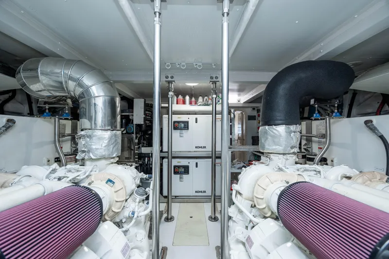 Slide: The Image of Engine room of a 2021 Azimut 72 yacht, featuring advanced machinery and ventilation systems. - 37
