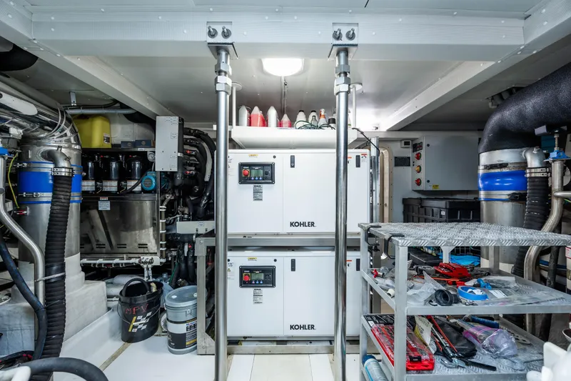 Slide: The Image of Engine room of a 2021 Azimut 72 yacht with Kohler generators and maintenance tools. - 38