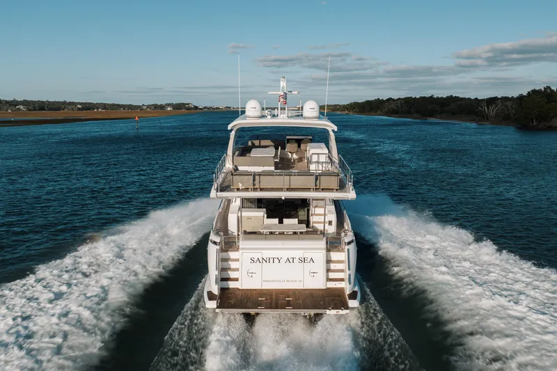 Slide: The Image of 2021 Azimut 72 yacht cruising on a scenic waterway, rear view. - 7