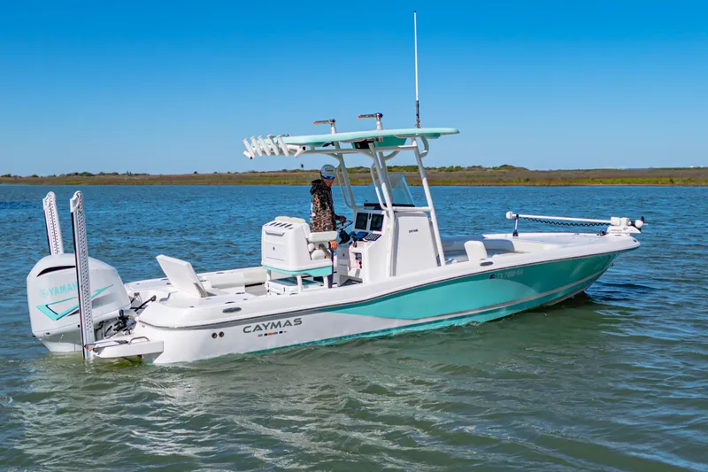 Slide: The Image of 2022 Caymas 26 HB boat on water, featuring sleek design and modern equipment. - 1