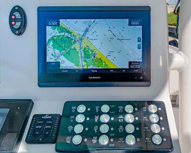 Slide: The Image of Garmin navigation display and control panel on 2022 Caymas 26 HB boat. - 12
