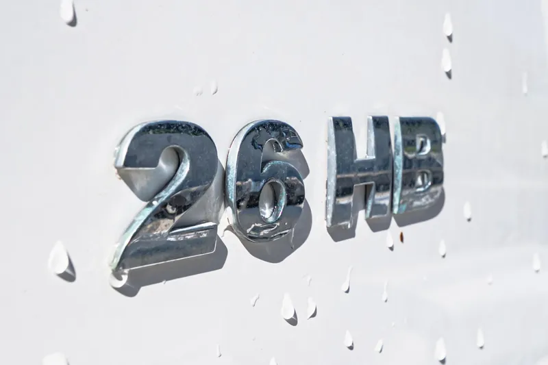 Slide: The Image of Chrome "26 HB" emblem on 2022 Caymas boat hull. - 15