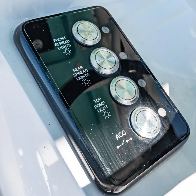 Slide: The Image of Control panel on 2022 Caymas 26 HB boat for lights and accessories. - 16