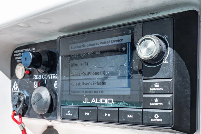 Slide: The Image of Control panel of a 2022 Caymas 26 HB boat with JL Audio system. - 17