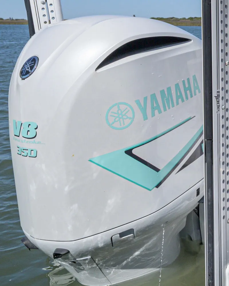 Slide: The Image of Yamaha V8 350 outboard motor on 2022 Caymas 26 HB boat in water. - 20
