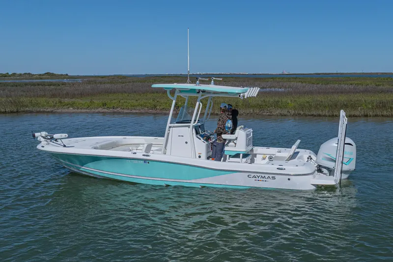 Slide: The Image of 2022 Caymas 26 HB boat on calm water with clear blue sky. - 3