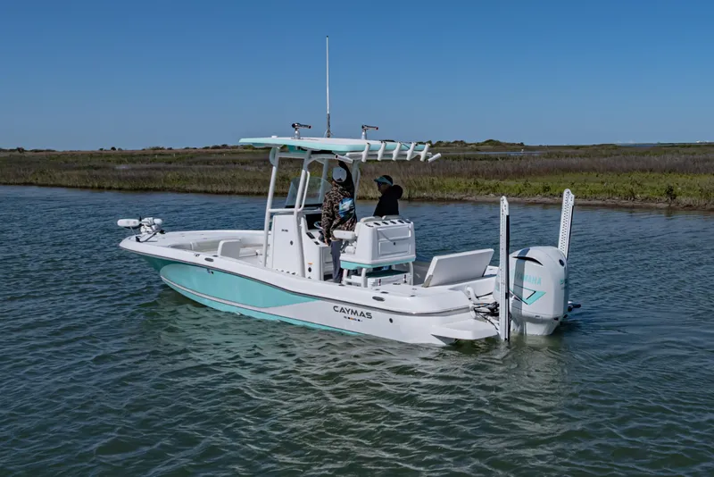 Slide: The Image of 2022 Caymas 26 HB boat on calm water with clear blue sky. - 4