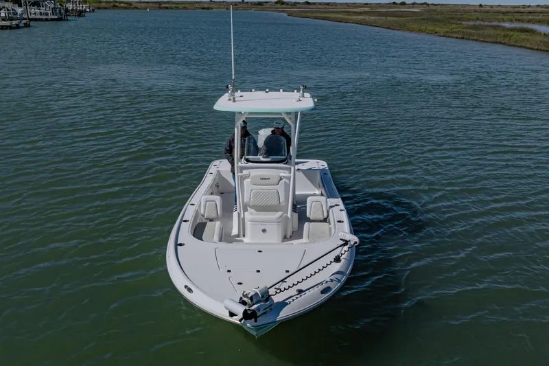 Slide: The Image of 2022 Caymas 26 HB boat on calm water, viewed from the front. - 6
