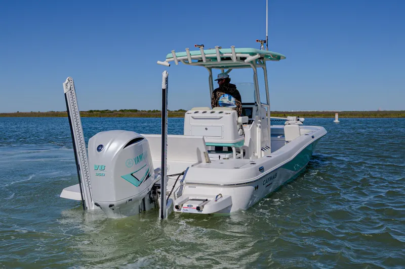 Slide: The Image of 2022 Caymas 26 HB boat on water, featuring Yamaha outboard motor. - 8