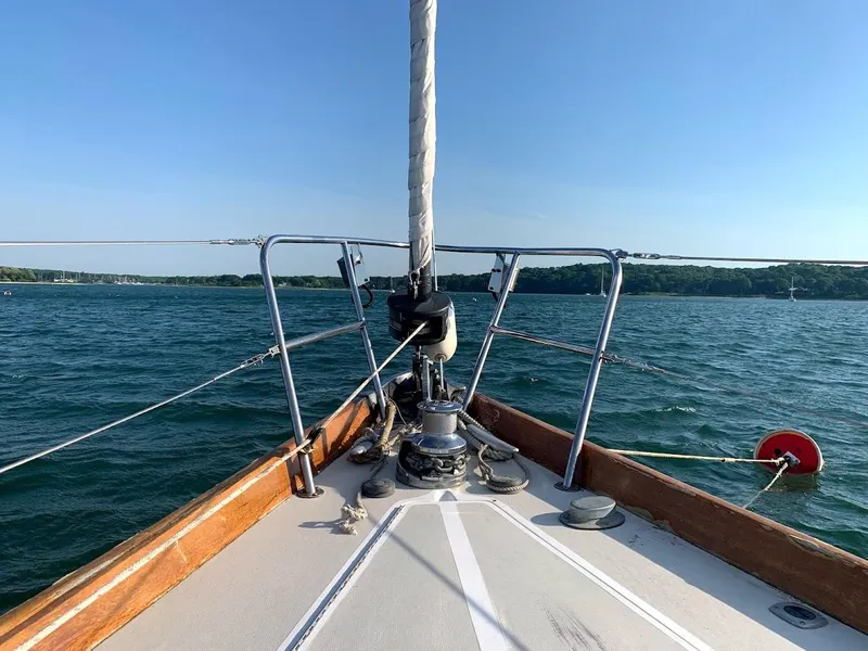 Slide: The Image of Sailing on a 1986 Bristol 38.8 yacht, calm waters, clear blue sky. - 2