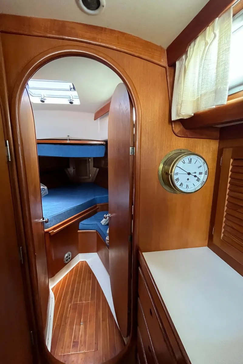 Slide: The Image of Interior of 1986 Bristol 38.8 sailboat with wooden finish and cozy cabin. - 20
