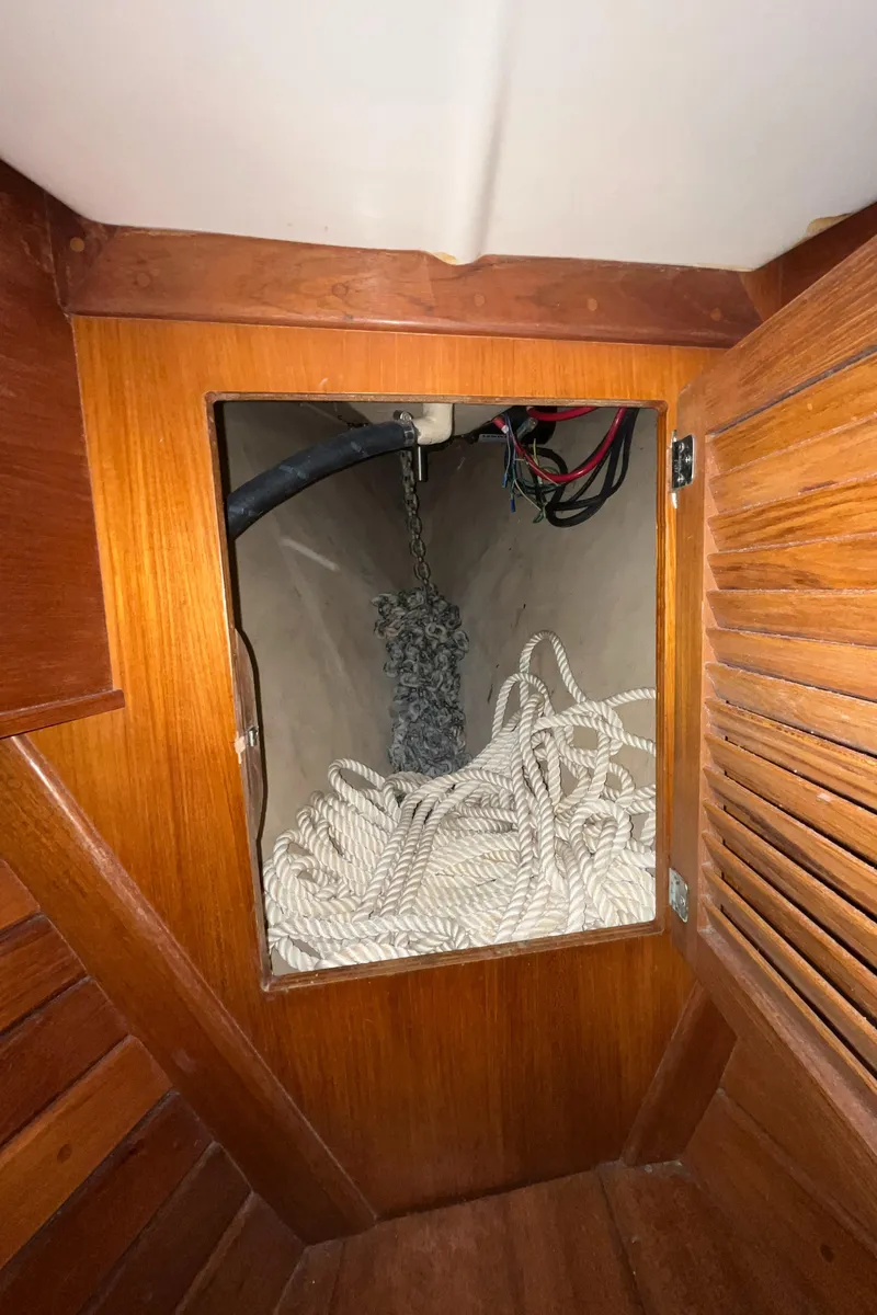 Slide: The Image of Interior view of 1986 Bristol 38.8 sailboat showing rope storage compartment. - 35
