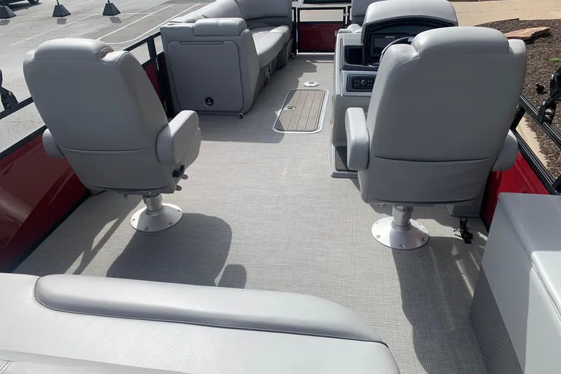 Slide: The Image of 2024 Regency R250DL3 boat interior with gray seating and modern dashboard. - 5